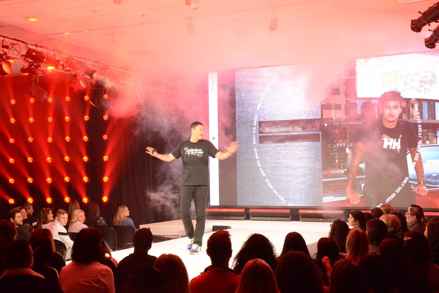 Company owner on stage presenting new brand